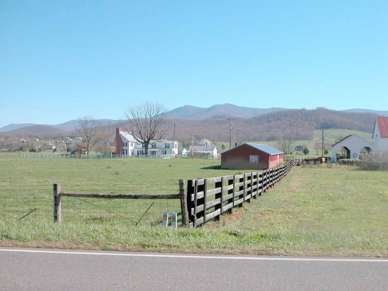 Farm country in the Shenandoah Valley, Virginia — fields, fences and farm buildings with the Blue Ridge beyond