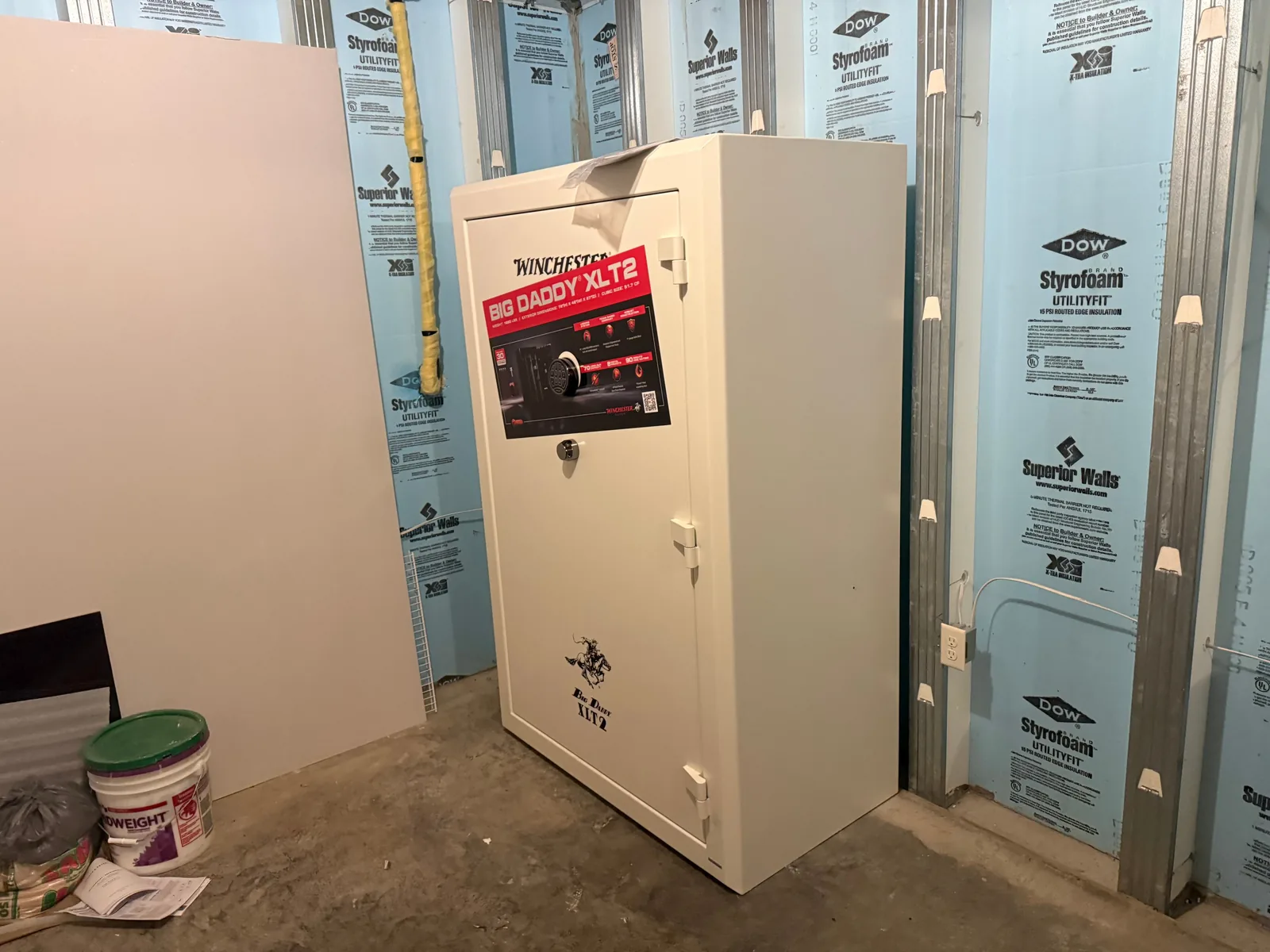 Wider view of the installed Winchester Big Daddy XLT2 gun safe in an unfinished basement